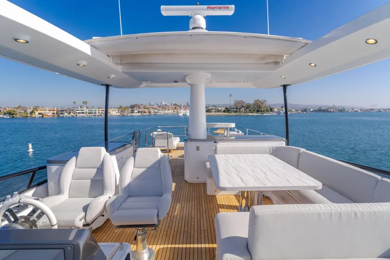 66 Magellano Yacht Photos Pics Luxurious 2023 Azimut Magellano 66 yacht deck with elegant seating and ocean view.