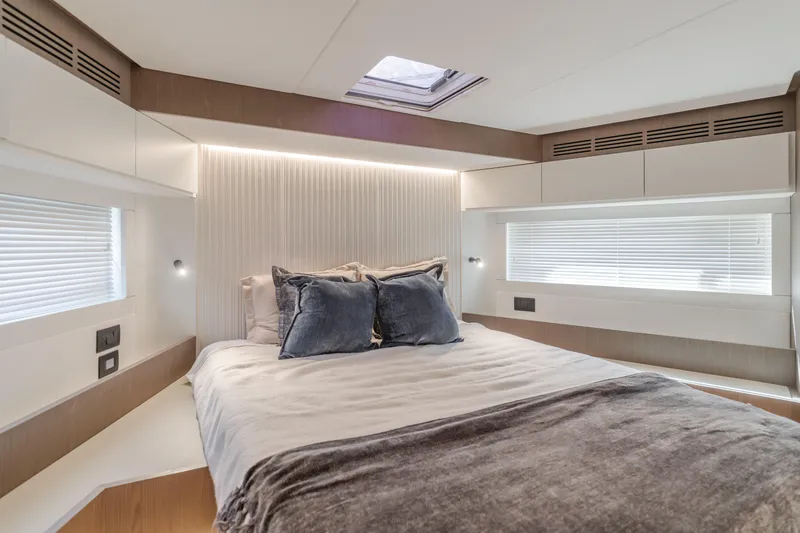 66 Magellano Yacht Photos Pics Luxurious bedroom interior of 2023 Azimut Magellano 66 yacht with modern design.