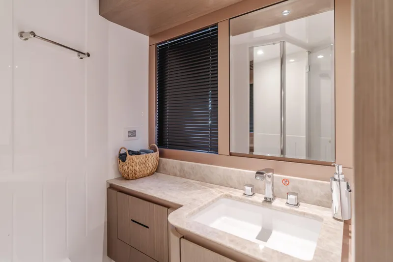 66 Magellano Yacht Photos Pics Luxurious bathroom in 2023 Azimut Magellano 66 yacht with modern fixtures and elegant design.