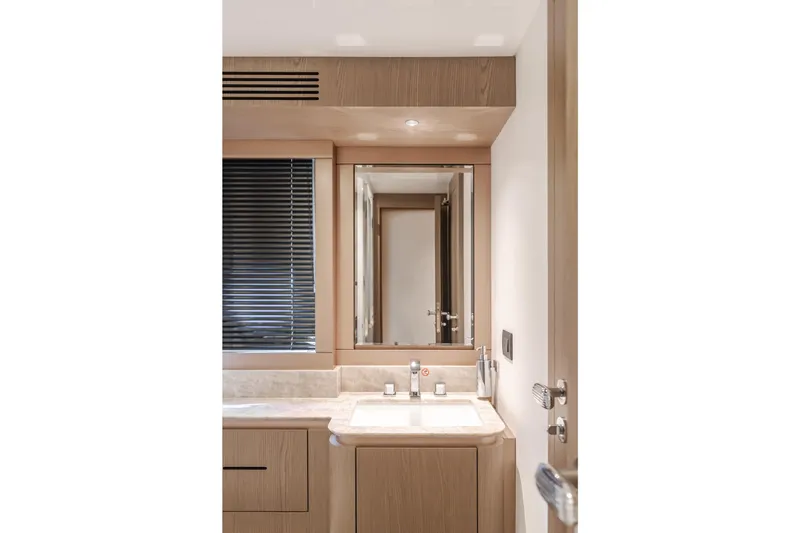 66 Magellano Yacht Photos Pics Luxurious bathroom interior of 2023 Azimut Magellano 66 yacht with modern fixtures.