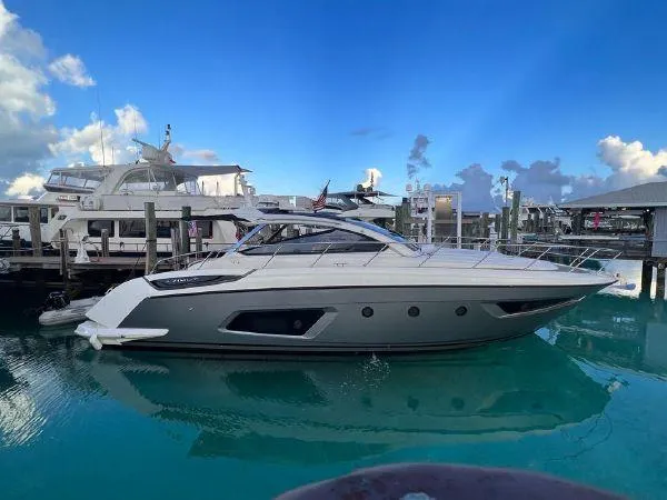  Yacht Photos Pics Azimut Atlantis 43 yacht, 2012 model, docked in a marina with clear blue skies.