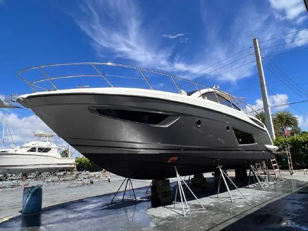  Yacht Photos Pics Azimut Atlantis 43 yacht, 2012 model, on dry dock under a clear blue sky.