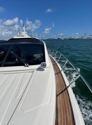  Yacht Photos Pics Azimut Atlantis 43 yacht cruising on open water under a clear blue sky.