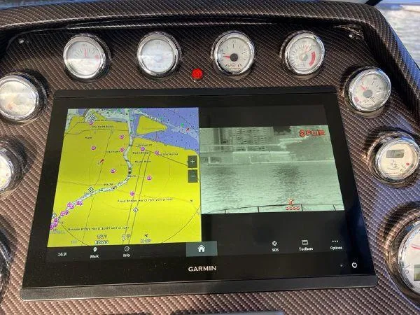  Yacht Photos Pics Garmin navigation display on 2012 Azimut Atlantis 43 yacht dashboard with gauges.