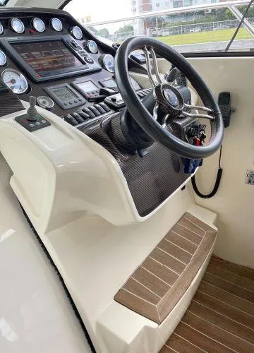  Yacht Photos Pics Cockpit of 2012 Azimut Atlantis 43 yacht with steering wheel and control panel.