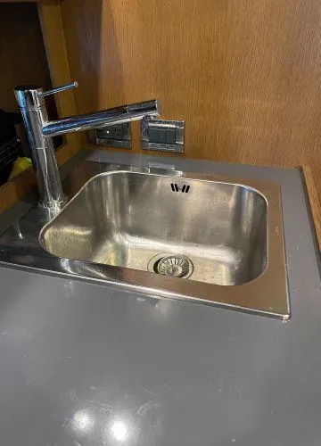  Yacht Photos Pics Stainless steel sink with modern faucet in 2012 Azimut Atlantis 43 yacht kitchen.