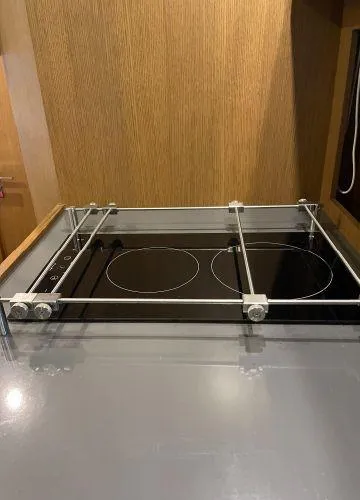  Yacht Photos Pics Modern kitchen stove on Azimut Atlantis 43 yacht, 2012 model, with sleek design and safety rails.