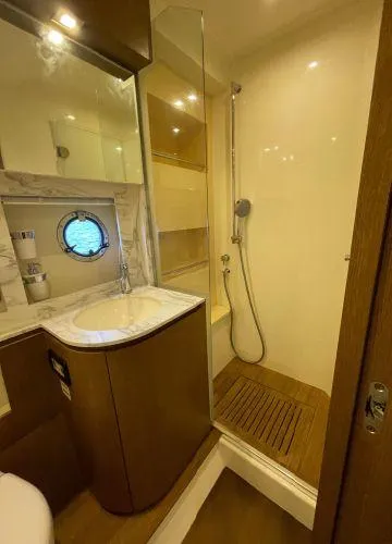  Yacht Photos Pics Luxurious bathroom in 2012 Azimut Atlantis 43 yacht with shower and porthole.