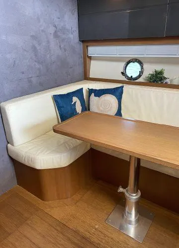  Yacht Photos Pics Interior of 2012 Azimut Atlantis 43 yacht with cozy seating and nautical-themed cushions.