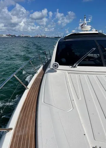  Yacht Photos Pics Azimut Atlantis 43 yacht cruising on open water under a clear blue sky.