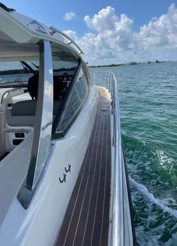  Yacht Photos Pics Azimut Atlantis 43 yacht cruising on clear waters under a blue sky, 2012 model.