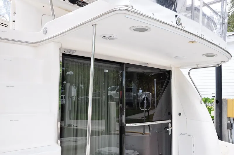  Yacht Photos Pics 1998 Sea Ray 480 Sedan Bridge yacht, rear deck view with sliding glass door.