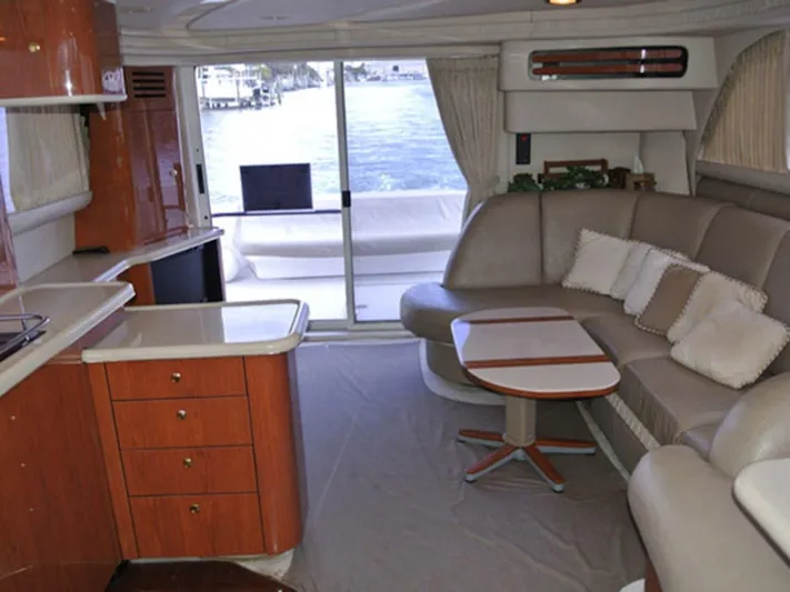  Yacht Photos Pics Interior of 1998 Sea Ray 480 Sedan Bridge yacht with modern furnishings and waterfront view.