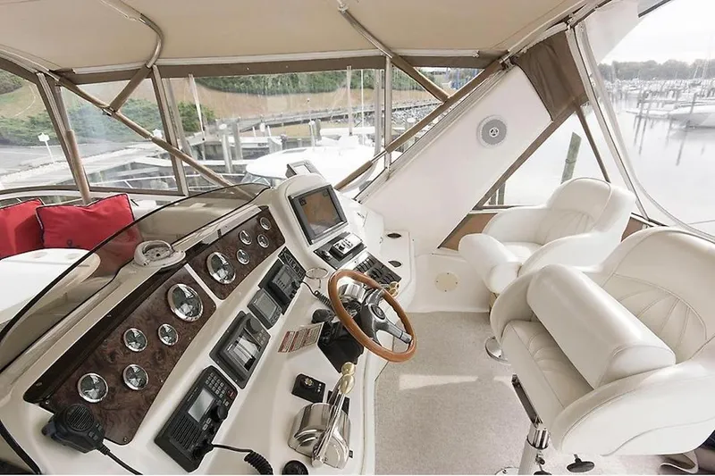  Yacht Photos Pics 1998 Sea Ray 480 Sedan Bridge helm with leather seats and advanced navigation controls.