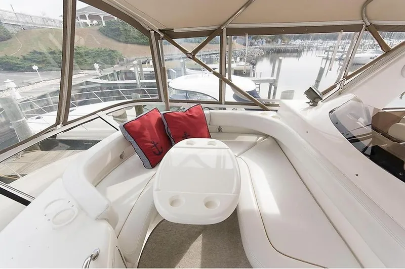  Yacht Photos Pics 1998 Sea Ray 480 Sedan Bridge interior with white seating and red cushions.