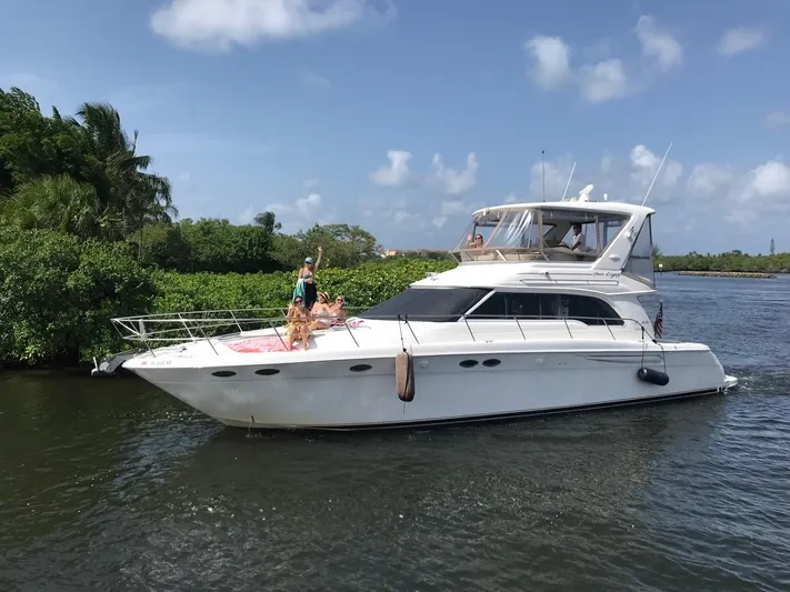  Yacht Photos Pics 1998 Sea Ray 480 Sedan Bridge yacht cruising on a sunny day.