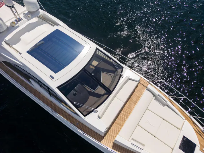 Ey IV Yacht Photos Pics 2016 Azimut 55S yacht with sunroof, sleek design, cruising on sparkling water.