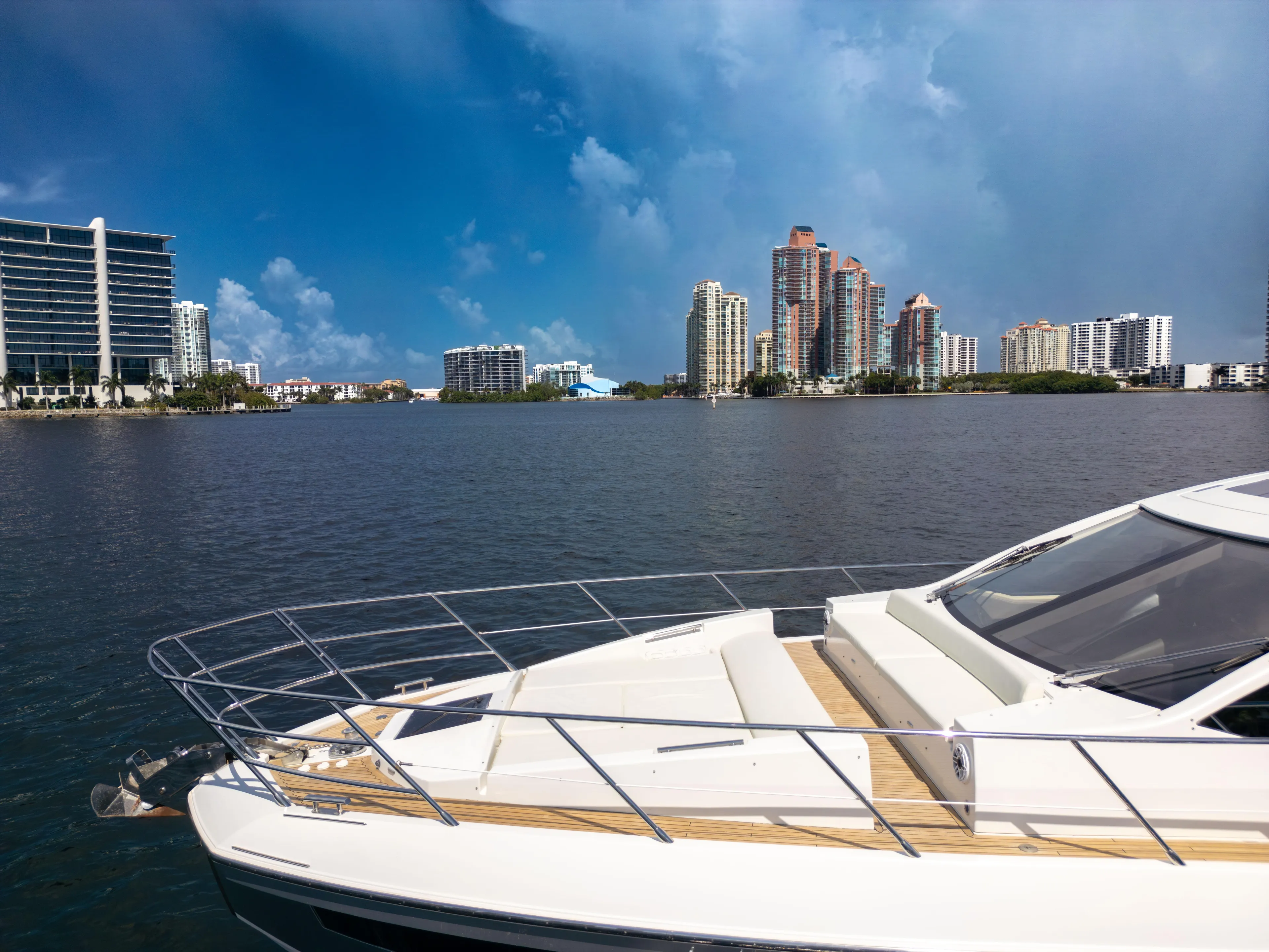 Ey IV Yacht Photos Pics 2016 Azimut 55S yacht on water with city skyline in background.
