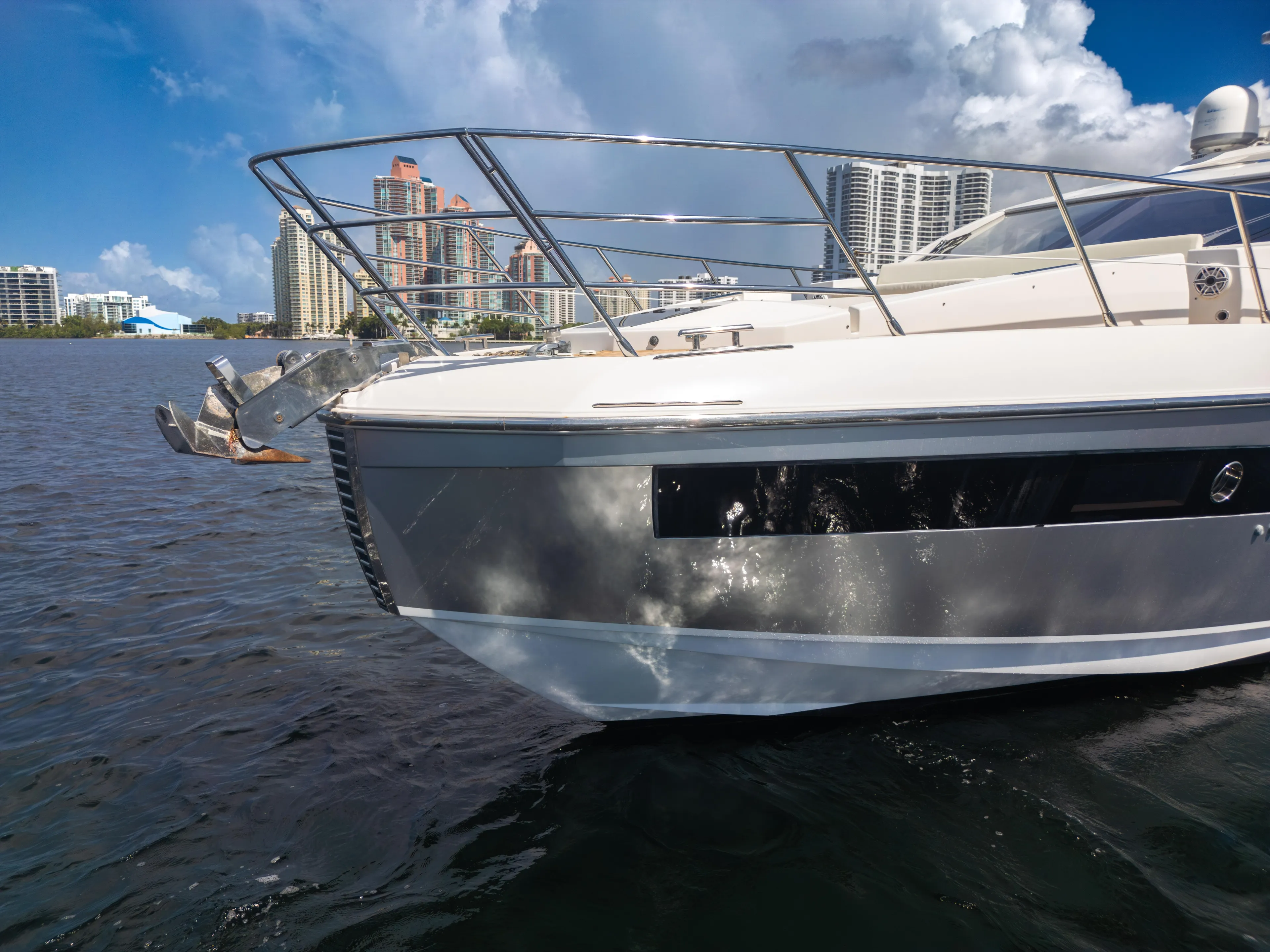 Ey IV Yacht Photos Pics 2016 Azimut 55S yacht on water with city skyline in background.