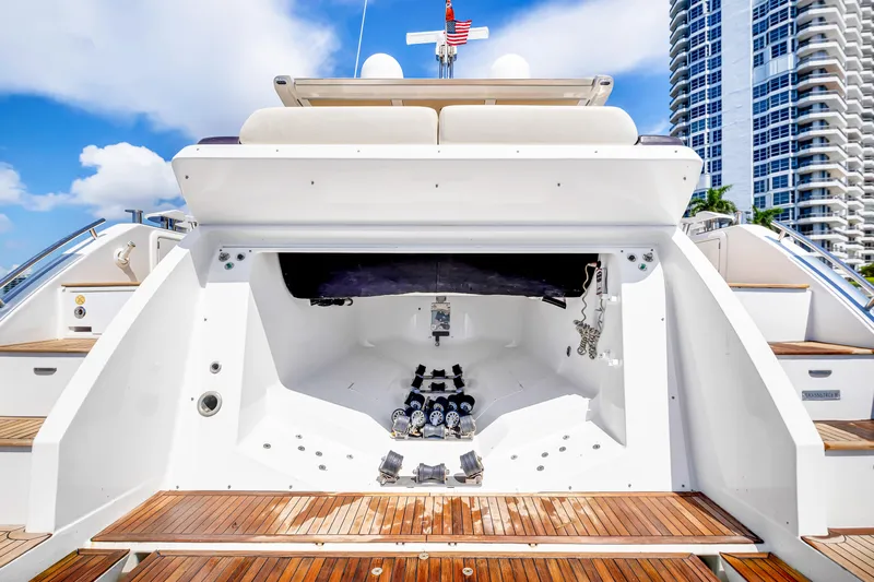 Ey IV Yacht Photos Pics 2016 Azimut 55S yacht stern view with wooden deck and urban skyline backdrop.