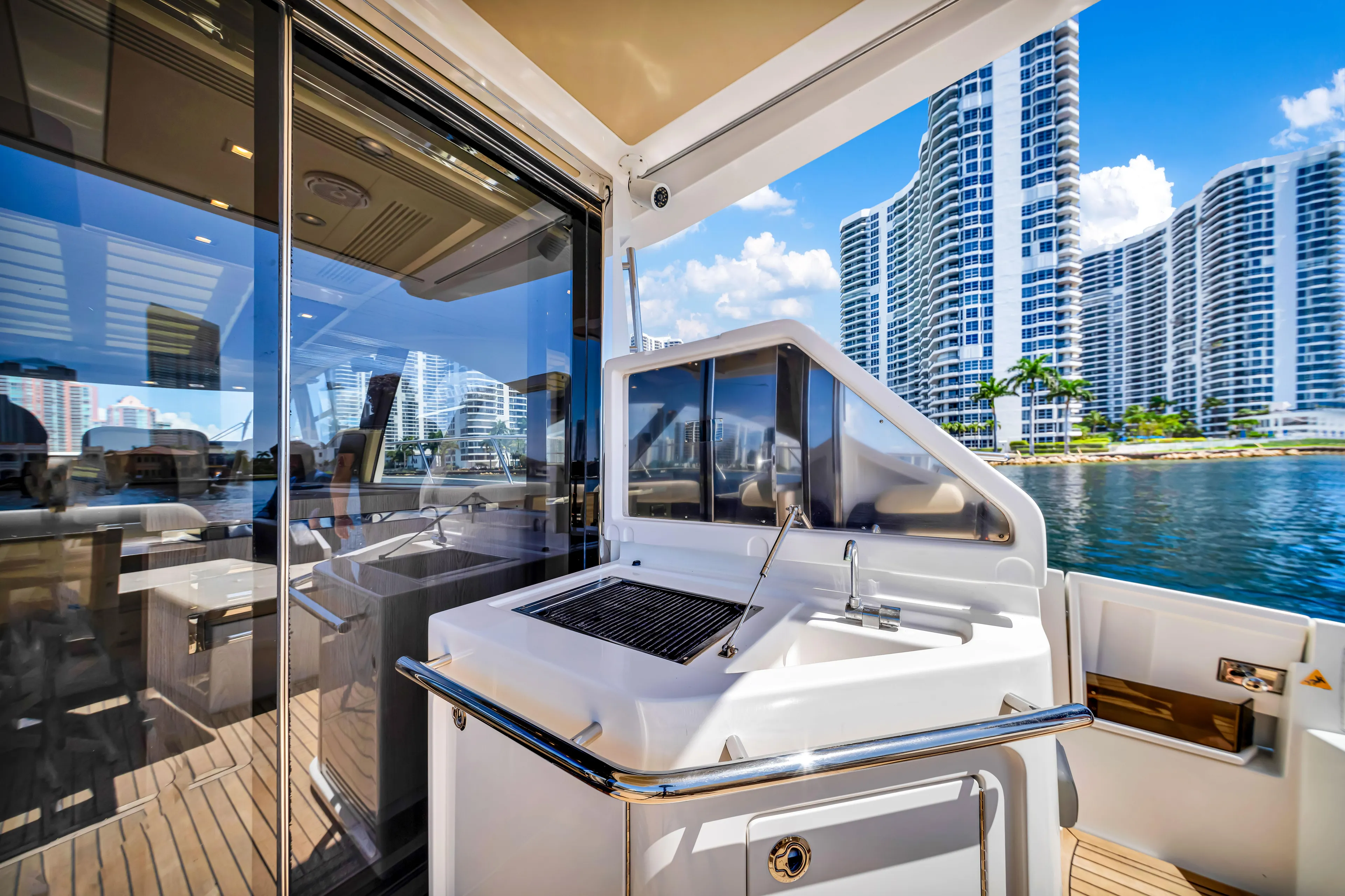 Ey IV Yacht Photos Pics Luxurious 2016 Azimut 55S yacht deck with modern cityscape view.