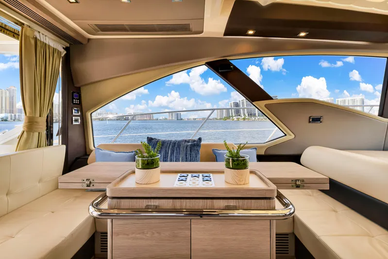 Ey IV Yacht Photos Pics Interior of 2016 Azimut 55S yacht with elegant seating and scenic ocean view.