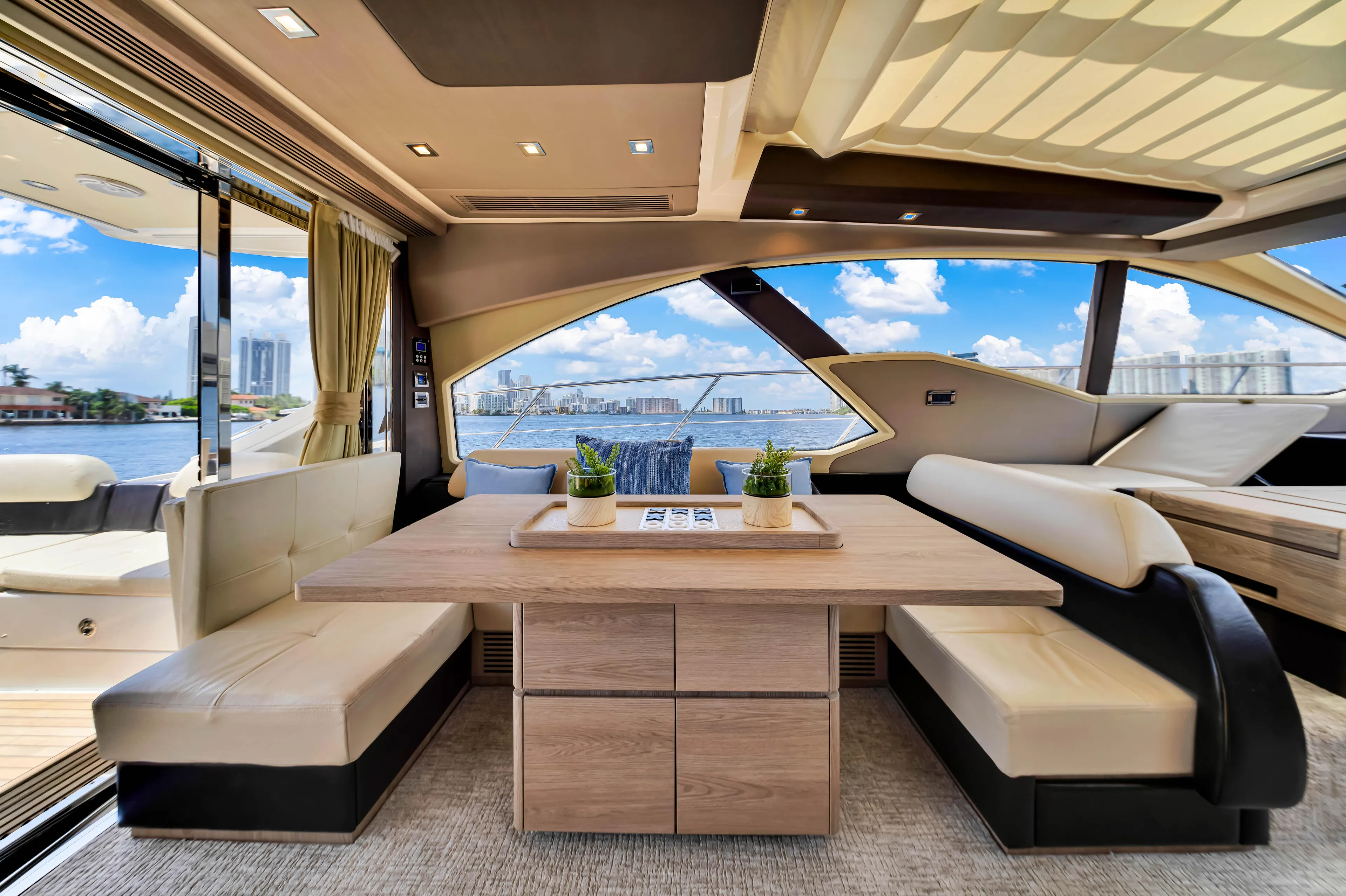 Ey IV Yacht Photos Pics Luxurious interior of 2016 Azimut 55S yacht with elegant seating and scenic views.