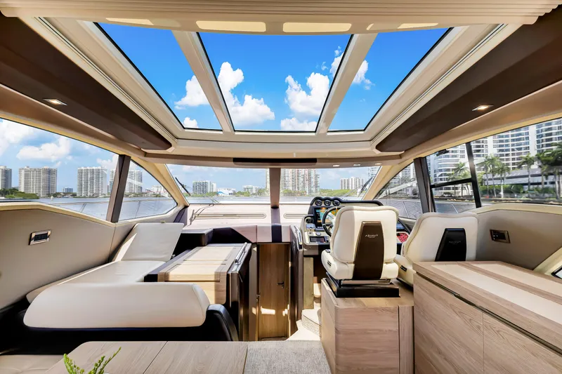 Ey IV Yacht Photos Pics Luxurious interior of a 2016 Azimut 55S yacht with panoramic windows and modern design.