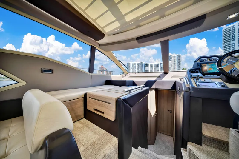 Ey IV Yacht Photos Pics Luxurious interior of 2016 Azimut 55S yacht with modern design and cityscape view.