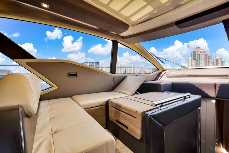 Ey IV Yacht Photos Pics Luxurious interior of 2016 Azimut 55S yacht with modern seating and city skyline view.