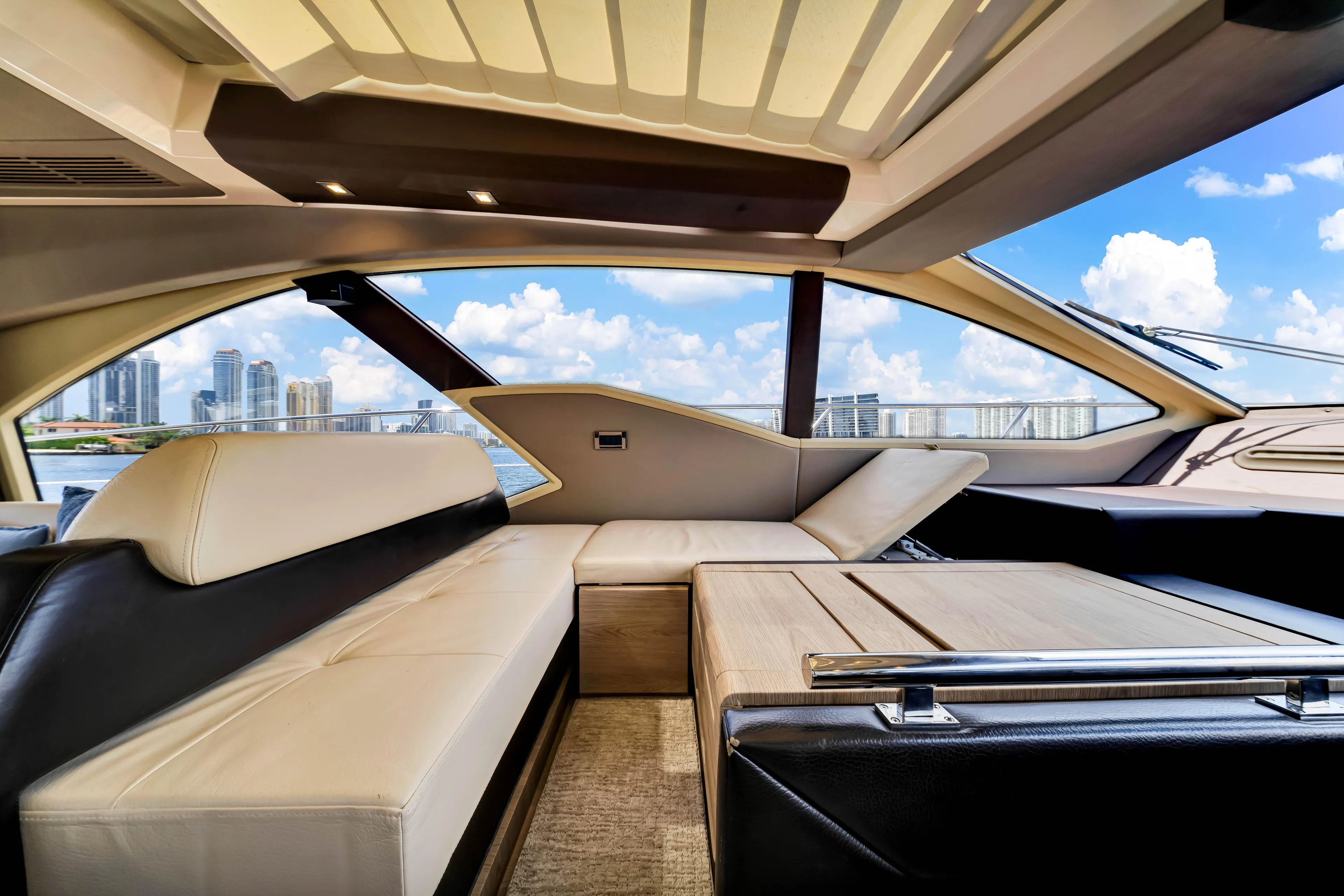 Ey IV Yacht Photos Pics Luxurious interior of 2016 Azimut 55S yacht with city skyline view.