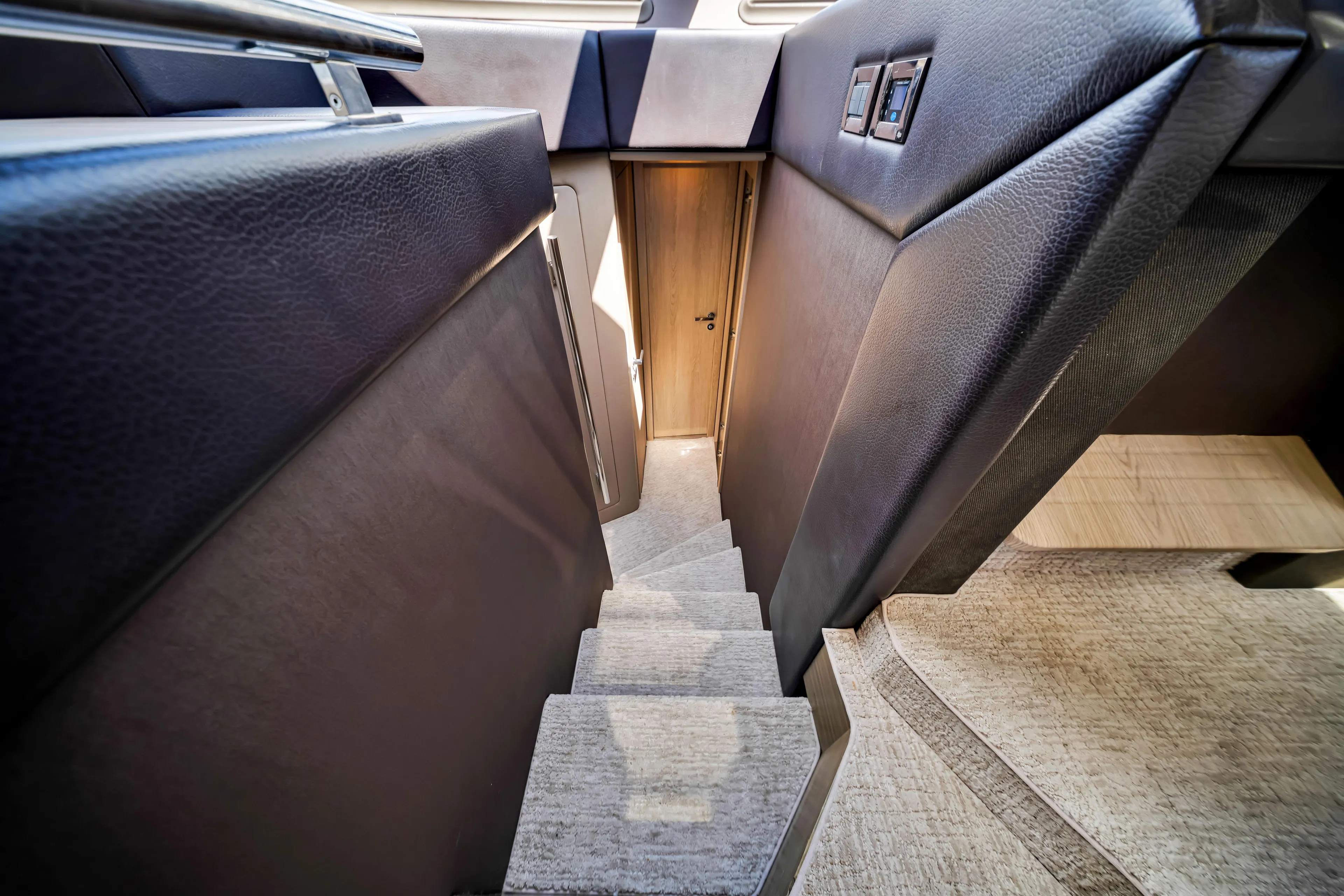 Ey IV Yacht Photos Pics Interior stairs of 2016 Azimut 55S yacht, featuring sleek design and modern materials.