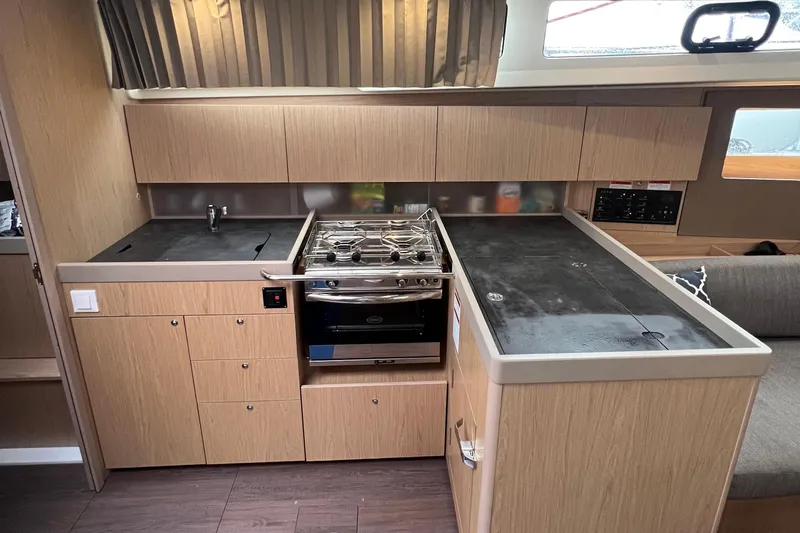  Yacht Photos Pics Modern kitchen in 2019 Beneteau Oceanis 41.1 yacht with stove and ample storage.