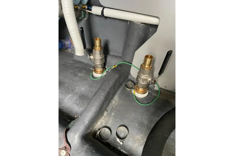  Yacht Photos Pics Engine room components of 2016 Cranchi Atlantique 43 yacht, featuring brass fittings and hoses.