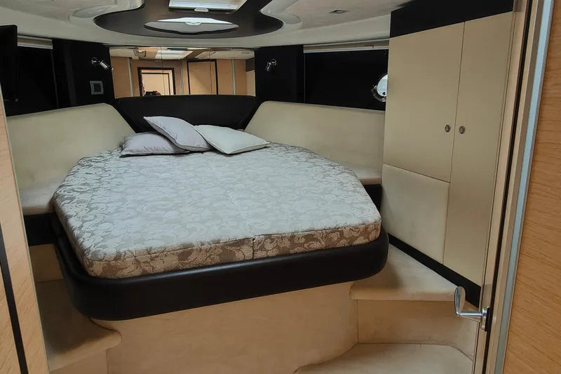  Yacht Photos Pics Luxurious cabin interior of 2016 Cranchi Atlantique 43 yacht with elegant bedding.