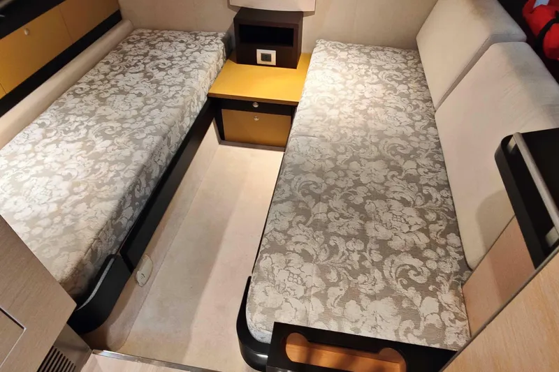  Yacht Photos Pics Luxurious cabin interior of 2016 Cranchi Atlantique 43 yacht with twin beds and elegant decor.
