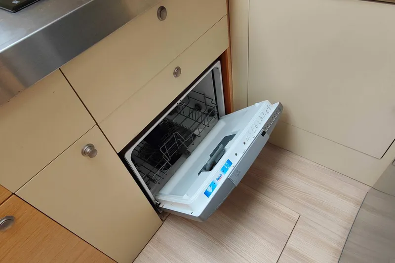  Yacht Photos Pics Open dishwasher in Cranchi Atlantique 43 yacht kitchen, 2016 model.