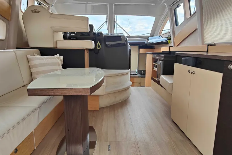  Yacht Photos Pics Interior of 2016 Cranchi Atlantique 43 yacht, featuring modern seating and helm station.