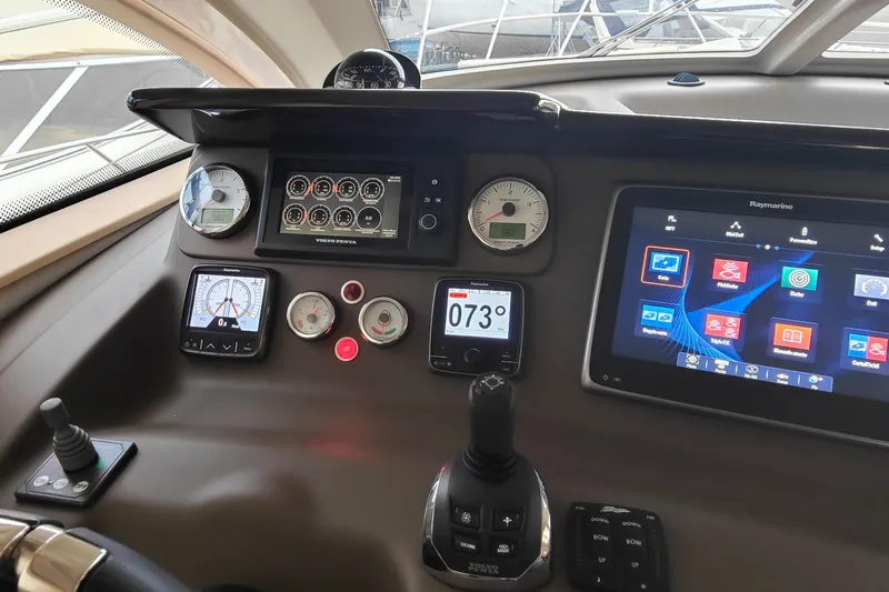  Yacht Photos Pics Cranchi Atlantique 43 yacht dashboard with navigation controls and digital displays, 2016 model.