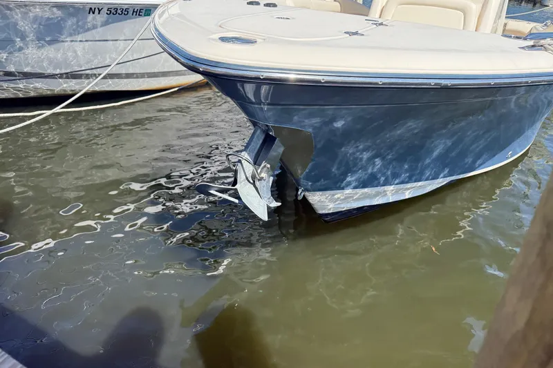  Yacht Photos Pics 2017 Grady-White Canyon 271 FS boat docked in water, front view.