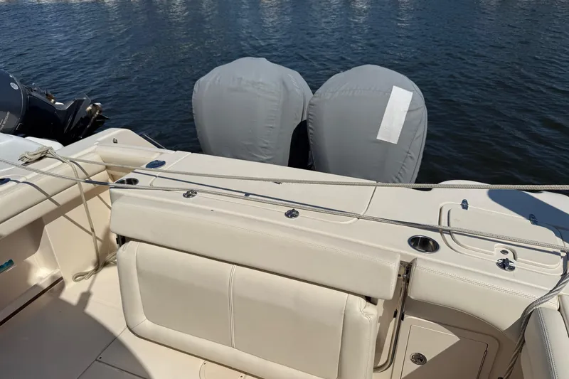  Yacht Photos Pics 2017 Grady-White Canyon 271 FS boat with covered engines on water.