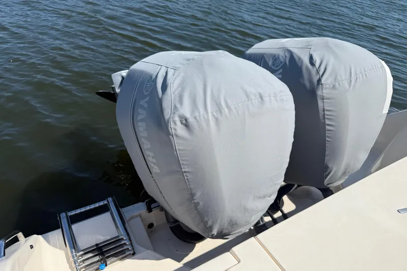  Yacht Photos Pics 2017 Grady-White Canyon 271 FS with covered Yamaha outboard motors on water.