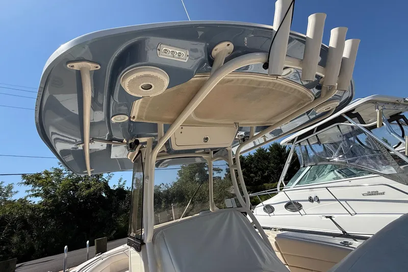  Yacht Photos Pics 2017 Grady-White Canyon 271 FS boat with T-top and rod holders, docked under clear sky.