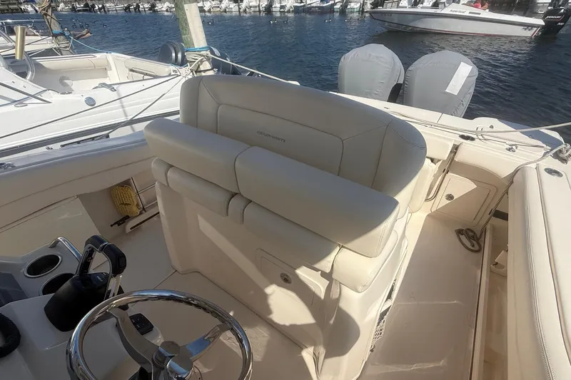  Yacht Photos Pics 2017 Grady-White Canyon 271 FS boat interior with helm and seating at marina.