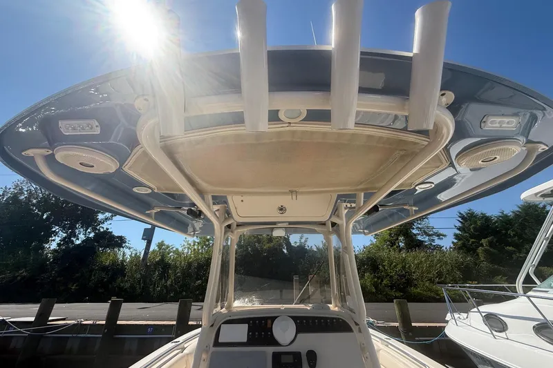  Yacht Photos Pics 2017 Grady-White Canyon 271 FS boat with T-top and console, under sunny sky.