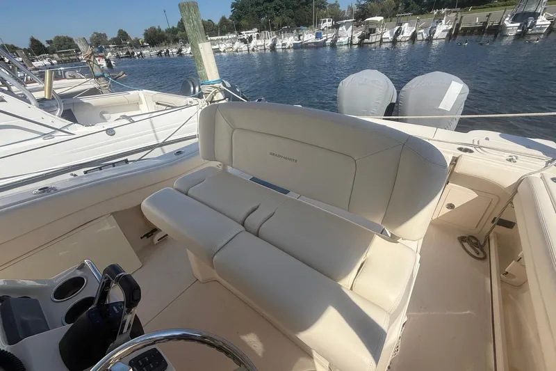  Yacht Photos Pics 2017 Grady-White Canyon 271 FS boat interior with seating, docked at marina.