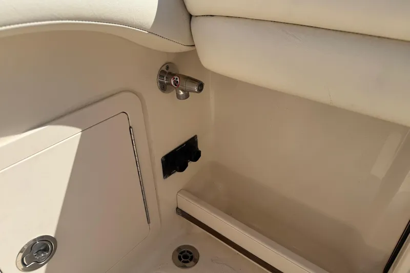  Yacht Photos Pics 2017 Grady-White Canyon 271 FS interior detail with storage compartment and drain.