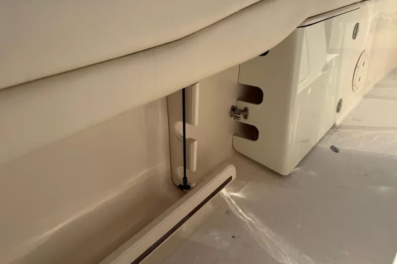  Yacht Photos Pics 2017 Grady-White Canyon 271 FS boat interior detail, showcasing storage compartment and seating.