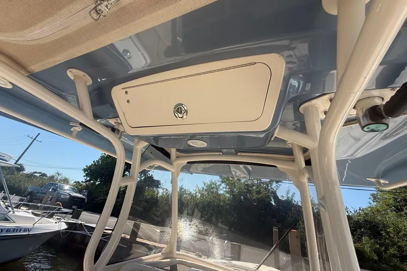  Yacht Photos Pics 2017 Grady-White Canyon 271 FS boat interior with storage compartment and canopy.