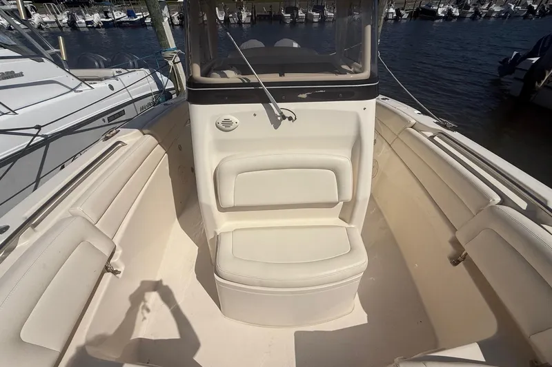  Yacht Photos Pics 2017 Grady-White Canyon 271 FS boat interior with seating, docked at marina.